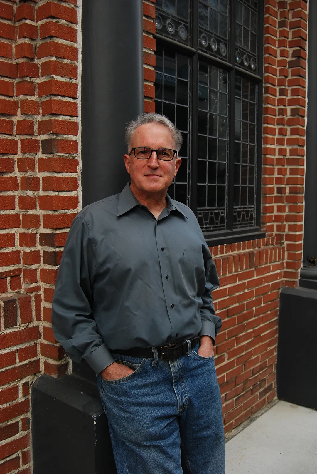 Howard Rappaport leaning against brick building